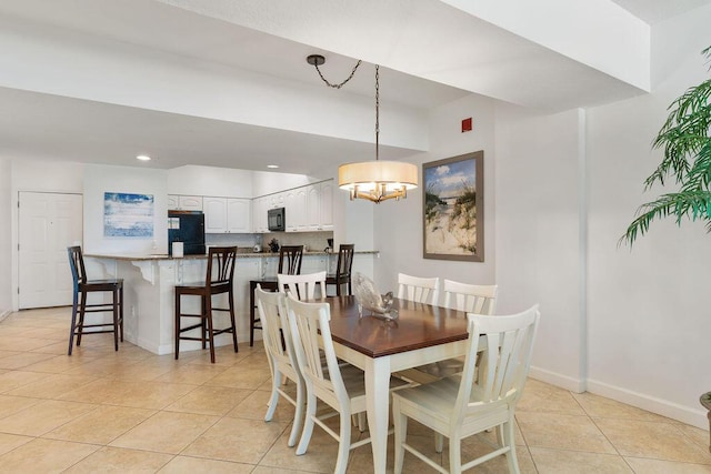 dining room with light tile patterned floors, baseboards, a chandelier, and recessed lighting