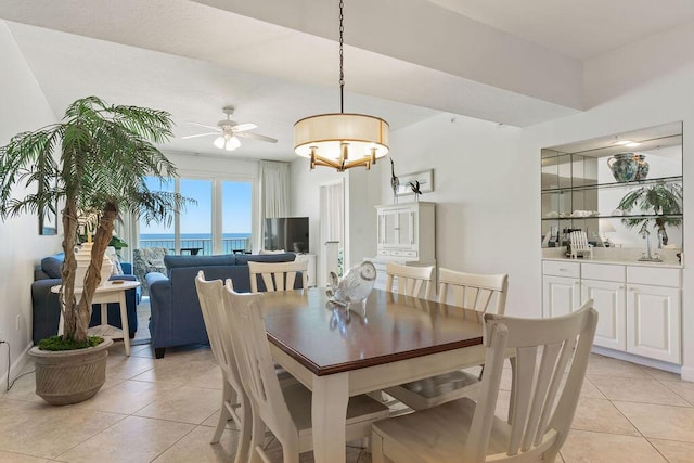 dining room with light tile patterned floors and a ceiling fan
