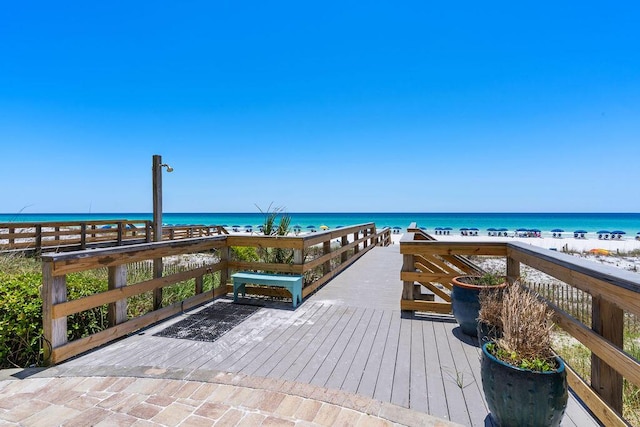 dock area with view of water and beach