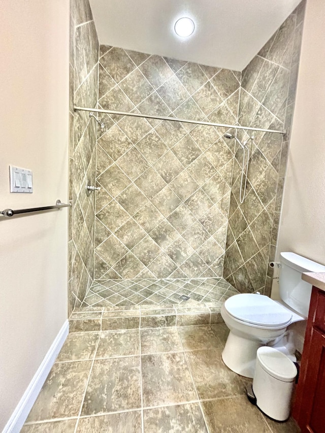 134 Rivercrest Cir, Santa Rosa Beach, FL 32459 - bathroom featuring toilet, tiled shower, vanity, and baseboards