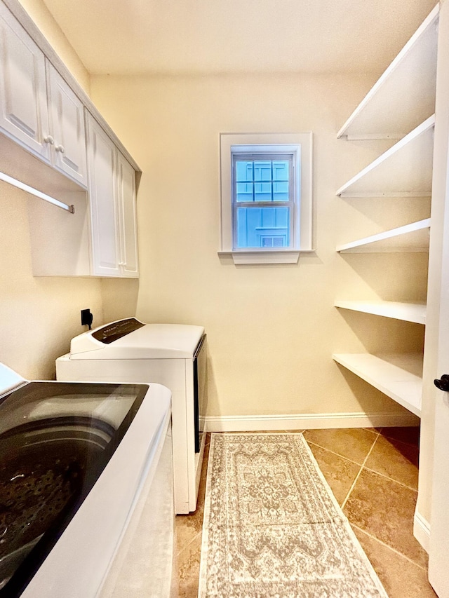 134 Rivercrest Cir, Santa Rosa Beach, FL 32459 - washroom featuring separate washer and dryer, cabinet space, light tile patterned floors, and baseboards