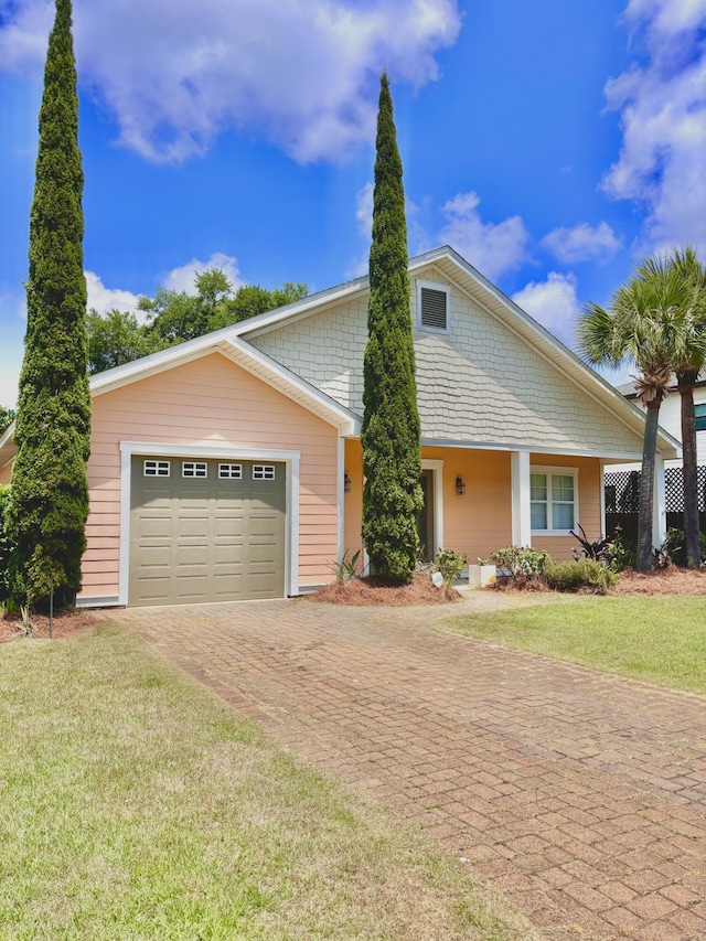 134 Rivercrest Cir, Santa Rosa Beach, FL 32459 - view of front of property featuring decorative driveway, an attached garage, and a front yard