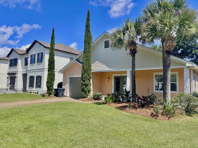 134 Rivercrest Cir, Santa Rosa Beach, FL 32459 - view of front of house with a garage, dirt driveway, and a front yard