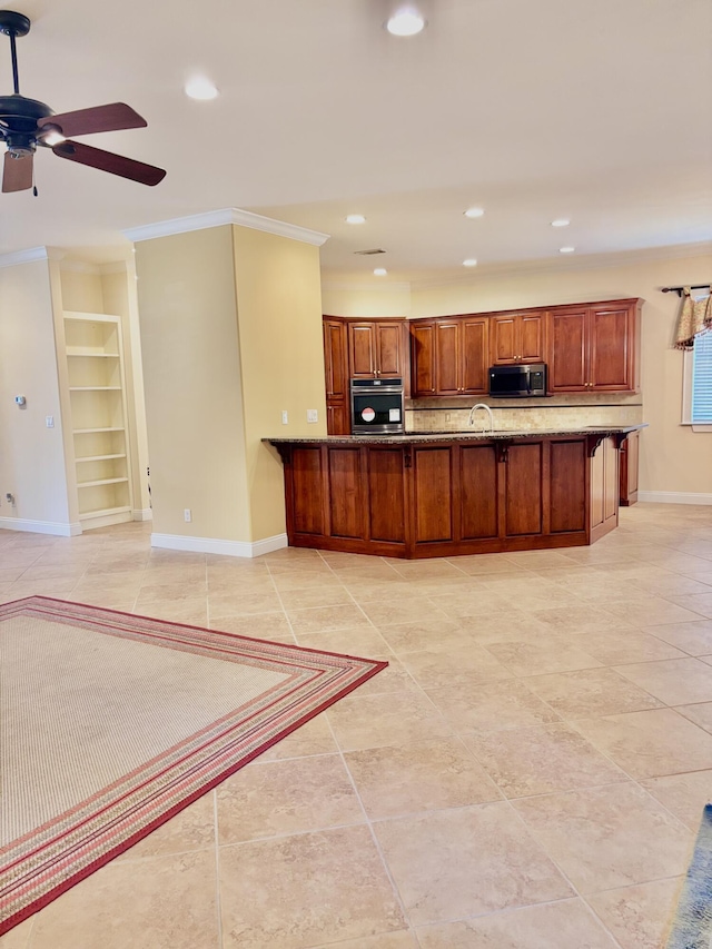 134 Rivercrest Cir, Santa Rosa Beach, FL 32459 - kitchen featuring stainless steel appliances, baseboards, built in shelves, recessed lighting, and dark stone countertops