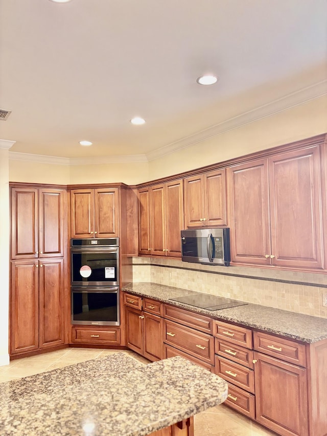 134 Rivercrest Cir, Santa Rosa Beach, FL 32459 - kitchen featuring appliances with stainless steel finishes, light stone countertops, crown molding, tasteful backsplash, and light tile patterned flooring