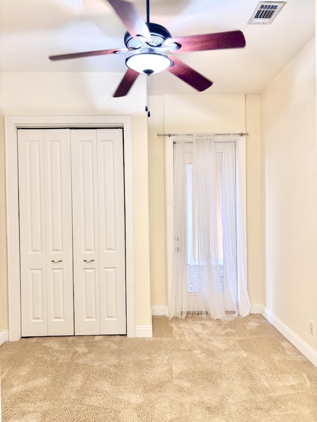 134 Rivercrest Cir, Santa Rosa Beach, FL 32459 - unfurnished bedroom featuring carpet floors, baseboards, a closet, and a ceiling fan