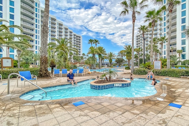 community pool featuring a patio area