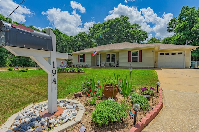 single story home with an attached garage, driveway, and a front yard