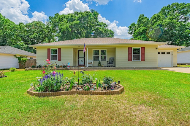 ranch-style house featuring fence, an attached garage, a front yard, concrete driveway, and covered porch