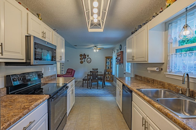kitchen with ceiling fan, a sink, a textured ceiling, light tile patterned floors, and black appliances
