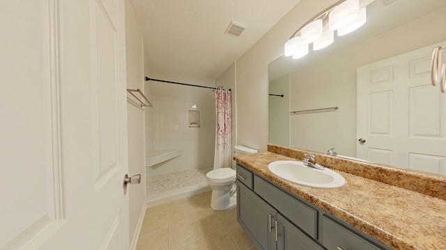 bathroom with visible vents, vanity, tile patterned floors, toilet, and a shower with shower curtain