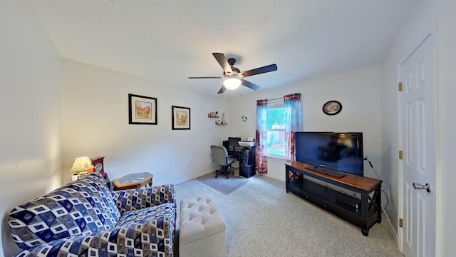 living room featuring carpet floors, baseboards, and ceiling fan