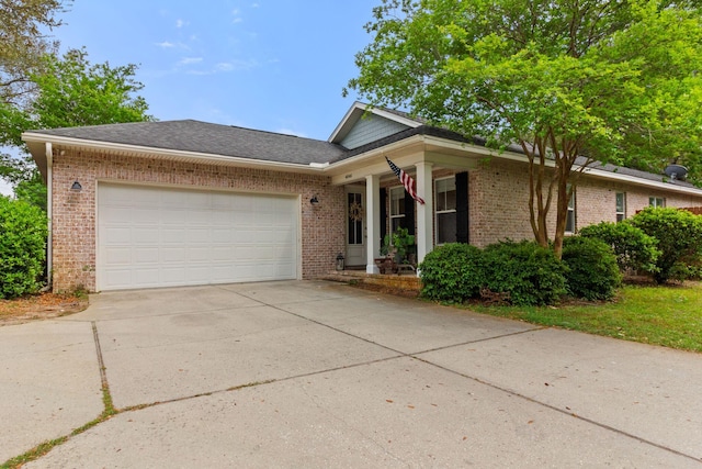4046 17th St, Niceville, FL 32578 - ranch-style home featuring brick siding, a garage, a porch, and concrete driveway