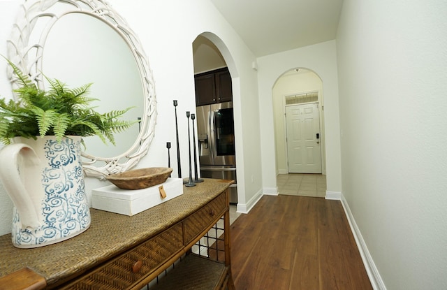 614 Red Fern Rd, Crestview, FL 32536 - hallway with dark wood-type flooring, baseboards, and arched walkways