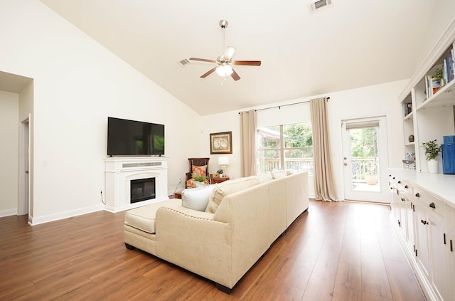 614 Red Fern Rd, Crestview, FL 32536 - living area with wood finished floors, a ceiling fan, a glass covered fireplace, high vaulted ceiling, and baseboards
