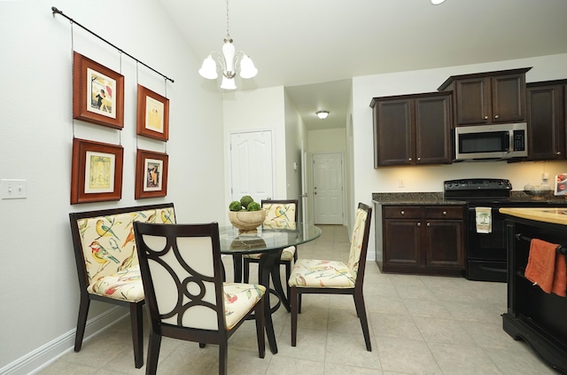 614 Red Fern Rd, Crestview, FL 32536 - dining room featuring a chandelier, baseboards, light tile patterned floors, and vaulted ceiling