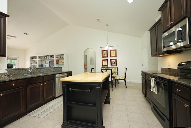 614 Red Fern Rd, Crestview, FL 32536 - kitchen with appliances with stainless steel finishes, a sink, arched walkways, vaulted ceiling, and light tile patterned flooring