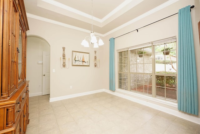 614 Red Fern Rd, Crestview, FL 32536 - unfurnished room featuring a chandelier, arched walkways, a tray ceiling, ornamental molding, and baseboards