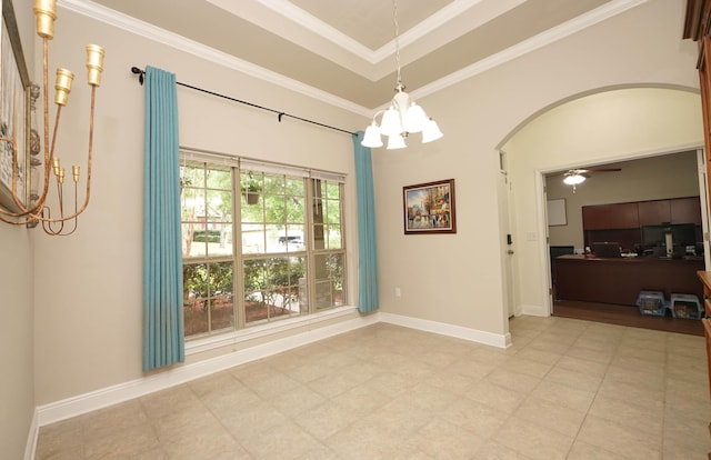 614 Red Fern Rd, Crestview, FL 32536 - unfurnished dining area featuring a chandelier, arched walkways, ceiling fan, crown molding, and a tray ceiling