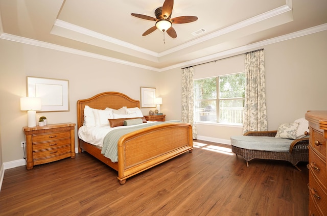 614 Red Fern Rd, Crestview, FL 32536 - bedroom with a tray ceiling, wood finished floors, baseboards, crown molding, and ceiling fan