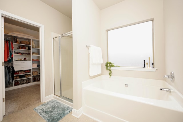 614 Red Fern Rd, Crestview, FL 32536 - full bathroom with a stall shower, a garden tub, and a spacious closet