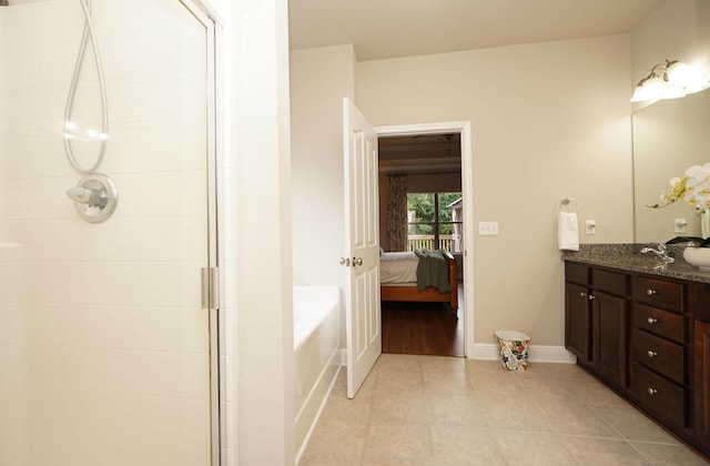 614 Red Fern Rd, Crestview, FL 32536 - ensuite bathroom featuring tile patterned flooring, a tile shower, vanity, and a bath