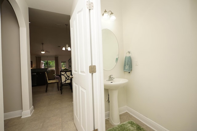 614 Red Fern Rd, Crestview, FL 32536 - bathroom featuring baseboards, a ceiling fan, and a sink