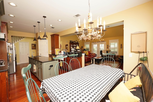 903 N Saint Andrews Cv, Niceville, FL 32578 - dining space featuring dark wood finished floors, a chandelier, recessed lighting, and french doors