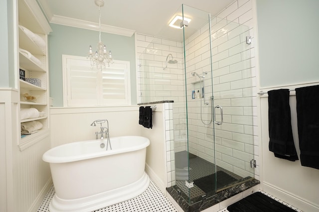903 N Saint Andrews Cv, Niceville, FL 32578 - full bath featuring a stall shower, a soaking tub, a chandelier, ornamental molding, and tile patterned floors