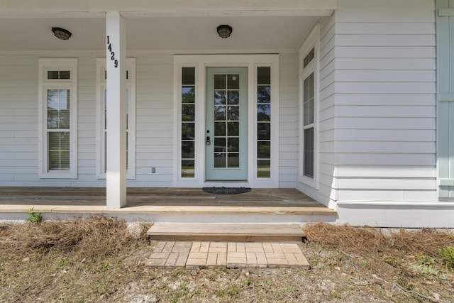 1429 N County Highway 393, Santa Rosa Beach, FL 32459 - view of exterior entry featuring covered porch