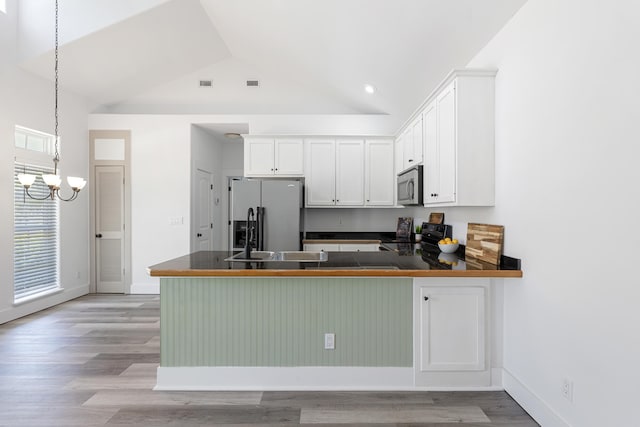 1429 N County Highway 393, Santa Rosa Beach, FL 32459 - kitchen featuring white cabinets, stainless steel appliances, and a peninsula