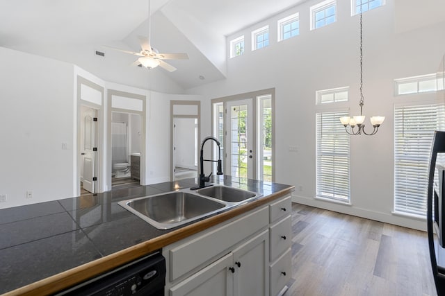 1429 N County Highway 393, Santa Rosa Beach, FL 32459 - kitchen featuring visible vents, black dishwasher, high vaulted ceiling, a sink, and ceiling fan with notable chandelier