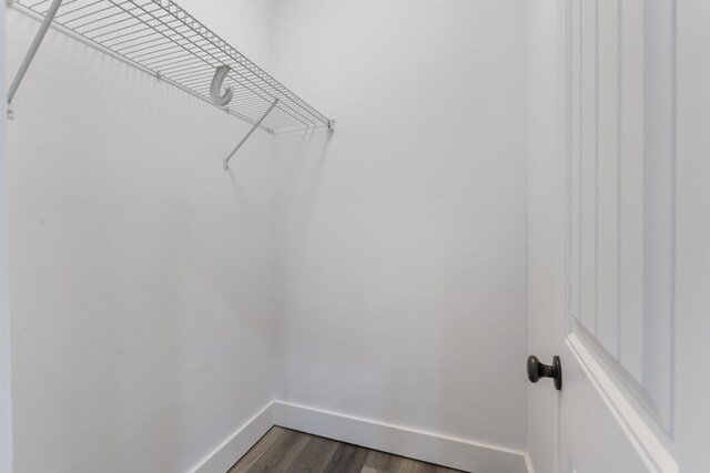 1429 N County Highway 393, Santa Rosa Beach, FL 32459 - spacious closet featuring dark wood-style flooring