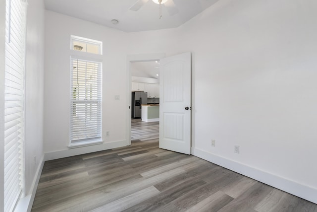 1429 N County Highway 393, Santa Rosa Beach, FL 32459 - spare room with baseboards, ceiling fan, and wood finished floors