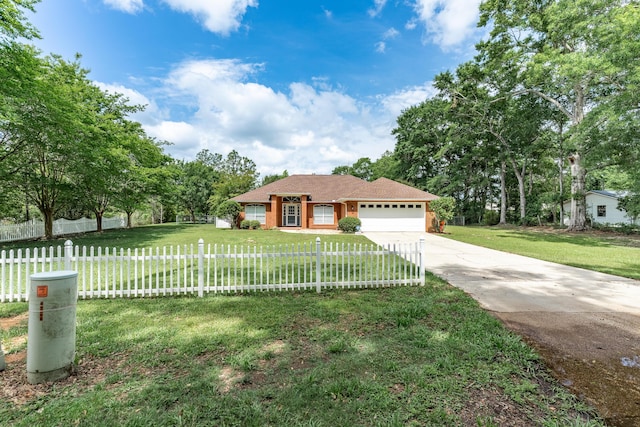 6100 Buck Ward Rd, Baker, FL 32531 - view of front facade with an attached garage, a fenced front yard, a front yard, and concrete driveway