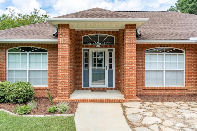 6100 Buck Ward Rd, Baker, FL 32531 - property entrance with brick siding and roof with shingles