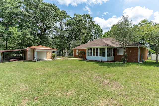 6100 Buck Ward Rd, Baker, FL 32531 - rear view of property with fence, a lawn, a garage, and brick siding