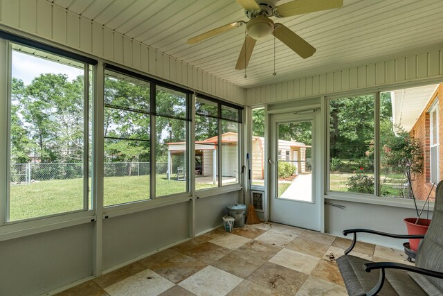 6100 Buck Ward Rd, Baker, FL 32531 - unfurnished sunroom featuring a ceiling fan and a wealth of natural light