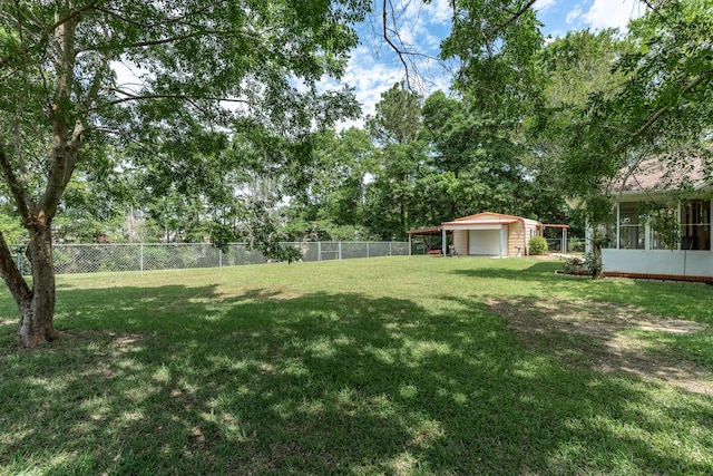6100 Buck Ward Rd, Baker, FL 32531 - view of yard with a detached garage, fence, and an outdoor structure