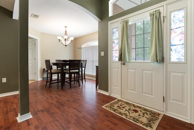 6100 Buck Ward Rd, Baker, FL 32531 - foyer with arched walkways, visible vents, a notable chandelier, and a wealth of natural light