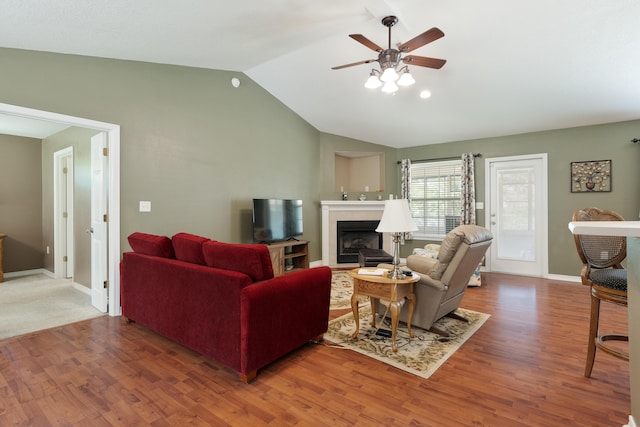 6100 Buck Ward Rd, Baker, FL 32531 - living area with a ceiling fan, a fireplace, wood finished floors, baseboards, and lofted ceiling