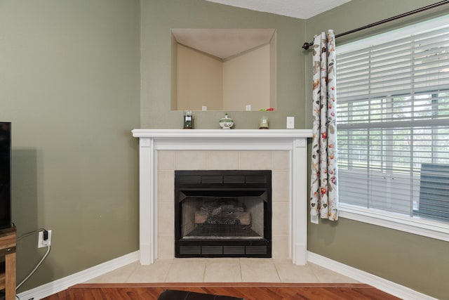 6100 Buck Ward Rd, Baker, FL 32531 - room details with baseboards and a tile fireplace