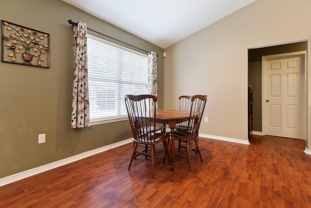 6100 Buck Ward Rd, Baker, FL 32531 - dining area with baseboards, vaulted ceiling, and wood finished floors
