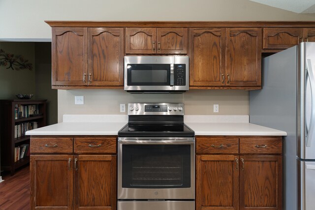 6100 Buck Ward Rd, Baker, FL 32531 - kitchen featuring light countertops, stainless steel appliances, and dark wood finished floors