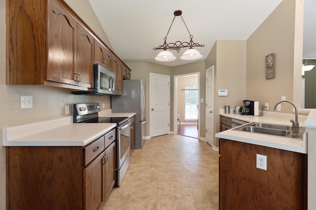 6100 Buck Ward Rd, Baker, FL 32531 - kitchen featuring appliances with stainless steel finishes, a sink, light tile patterned floors, baseboards, and light countertops