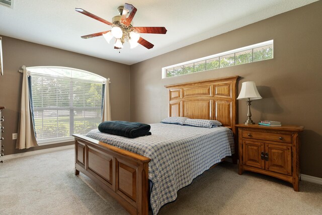 6100 Buck Ward Rd, Baker, FL 32531 - bedroom with baseboards, multiple windows, light carpet, and ceiling fan