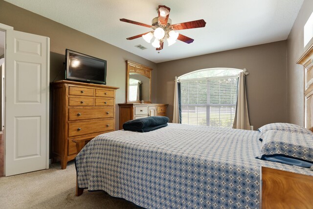 6100 Buck Ward Rd, Baker, FL 32531 - bedroom with visible vents, ceiling fan, and light carpet