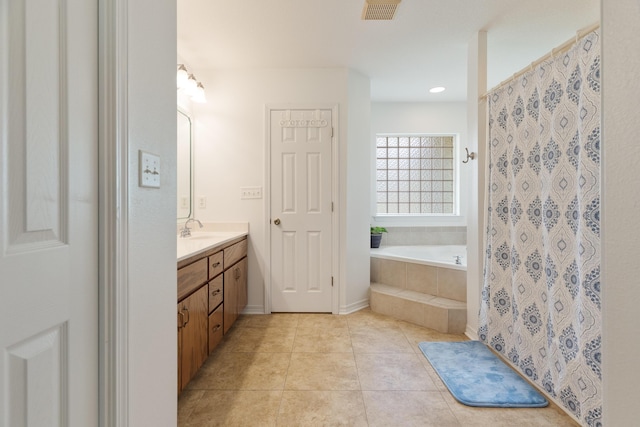 6100 Buck Ward Rd, Baker, FL 32531 - full bathroom with visible vents, tile patterned flooring, a garden tub, vanity, and a shower with shower curtain