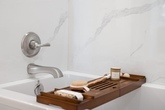 bathroom with a washtub