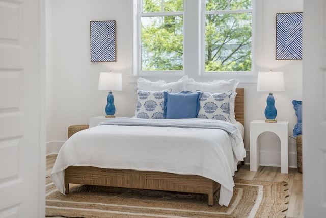 bedroom with wood finished floors